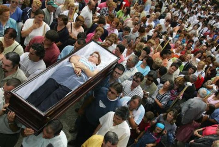 People In Spain Celebrate Being Alive By Having Their Relatives Cart Them Around in Caskets